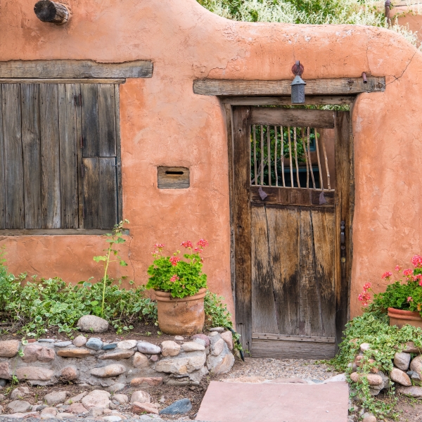 Old door in adobe wall in Santa Fe, New Mexico